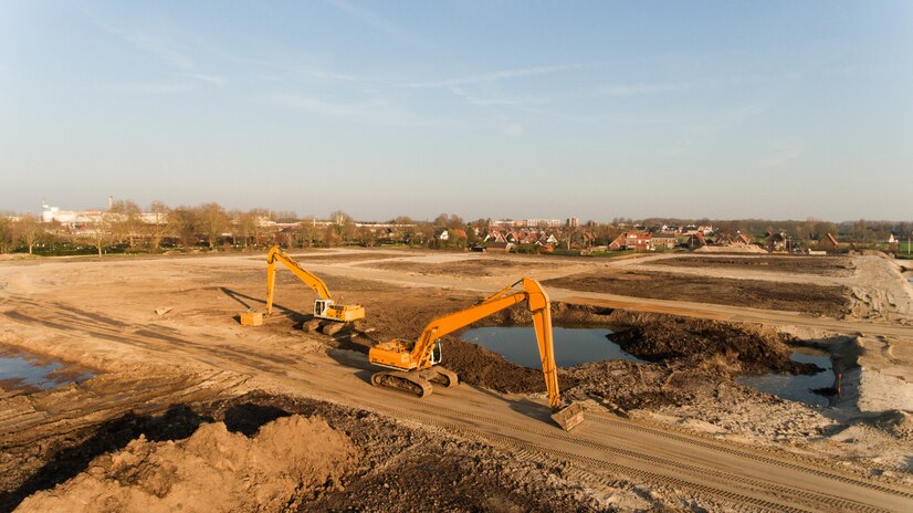 https://unipol.co.ke/wp-content/uploads/2025/01/high-angle-shot-two-excavators-building-site_181624-7771.jpg